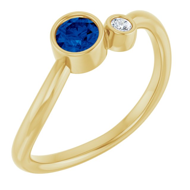 Lab-Grown Blue Sapphire Round Accented Bezel-Set Ring in 14K Yellow Gold